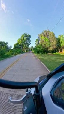 Point of view riding on a scooter motorbike in the Philippines, tropical landscapes and Asian roads, travelling backpacking holiday vacation footage 