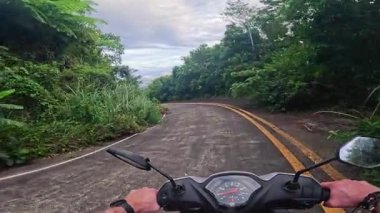 Dramatic lush tropical jungle and volcanic mountain views on Camiguin Island Philippines, captured as travel and tourism content for vacation and backpacking media