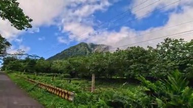 Dramatic lush tropical jungle and volcanic mountain views on Camiguin Island Philippines, captured as travel and tourism content for vacation and backpacking media