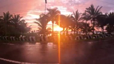 Point of view of tropical sunset in the Philippines with palm tree beaches, golden light, lush surroundings and tranquil holiday atmosphere for tourism content