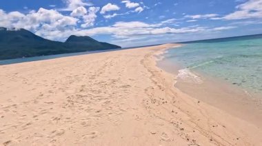 Point of view perspective of tropical beach, clear blue waters and white sand, Asian Philippines White island Camiguin, vacation holiday tourism 
