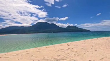 Point of view perspective of tropical beach, clear blue waters and white sand, Asian Philippines White island Camiguin, vacation holiday tourism 