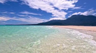 Point of view perspective of tropical beach, clear blue waters and white sand, Asian Philippines White island Camiguin, vacation holiday tourism 