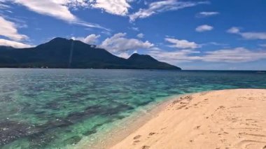 Point of view perspective of tropical beach, clear blue waters and white sand, Asian Philippines White island Camiguin, vacation holiday tourism 
