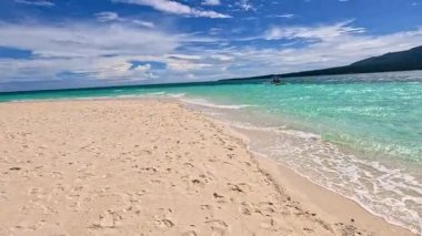 Point of view perspective of tropical beach, clear blue waters and white sand, Asian Philippines White island Camiguin, vacation holiday tourism 