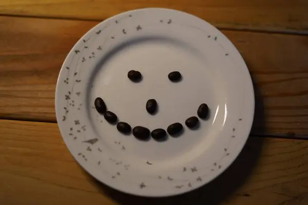 Coffee bean art, smiley face