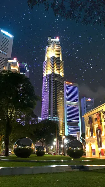 Night City Landscape: Urban Glow with a Skyscraper Building