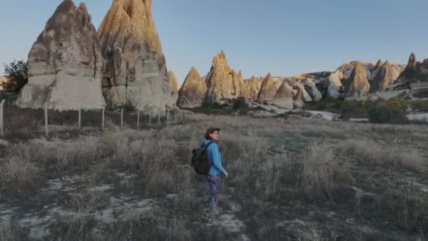 Traveler Girl Backpack Hat Wanders Rocks Cappadocia Aerial View — Stock Video