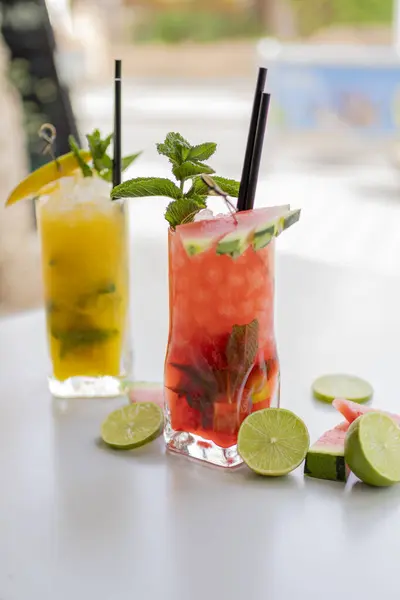 Strawberry and mango mojito decorated with druits