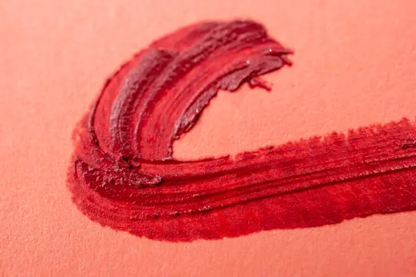 Pensla Stroke Röd Färg Persikofärgad Rosa Bakgrund Läppstift Märken Papper — Stockfoto