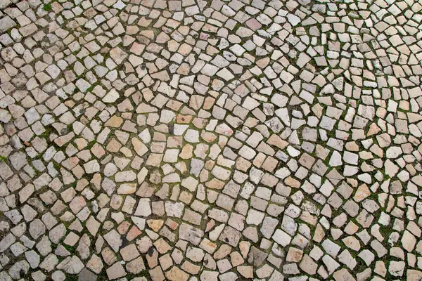 Paved pavement close up, granite cobblestoned pavement background, abstract stone pavement texture
