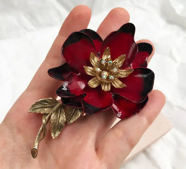 stock image Red vintage brooch in the shape of a flower