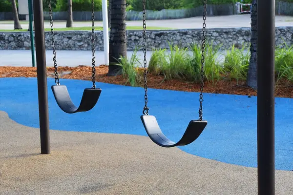 Swing for children in a playground, close-up of photo