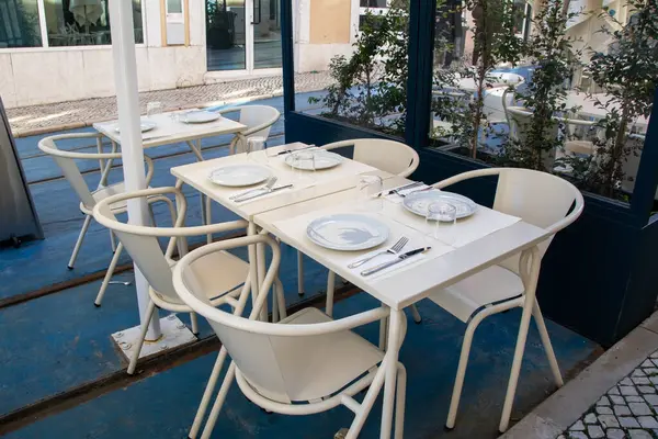 Tables and chairs in a cafe in Barcelona, Catalonia, Spain