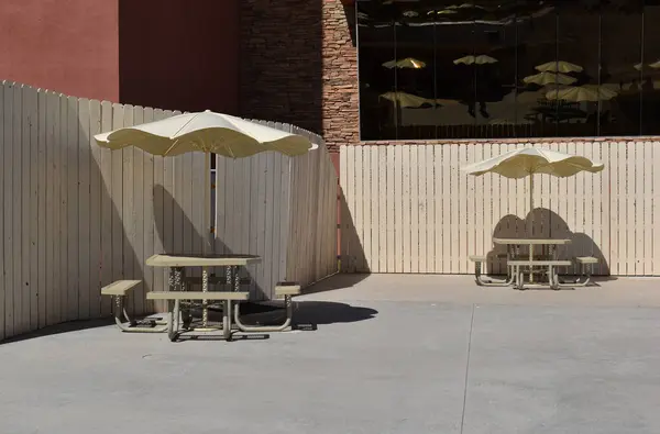 Outdoor cafe with chairs and umbrellas on a sunny day