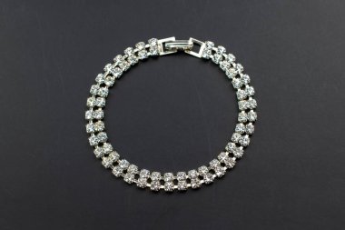 Jewelry Bracelet with diamonds on a black background.