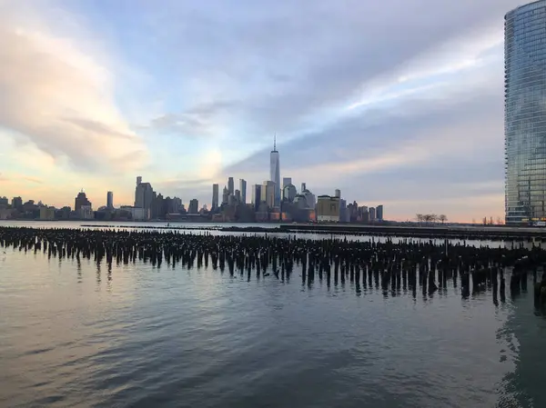 stock image New York City Manhattan skyline at sunset with urban skyscrapers.