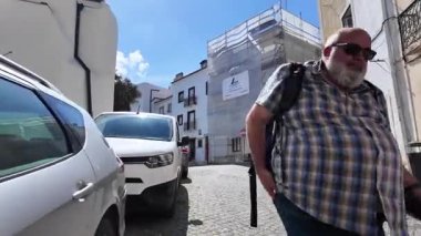 Narrow road Lisbon city walk POV old architecture travel Europe