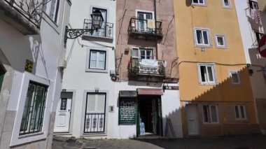 POV stroll narrow Lisbon alley historic path city Europe vibe