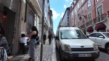 Walking point of view old Lisbon street narrow path Europe trip