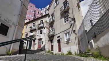 Lisbon walking point of view narrow street travel vibe Europe