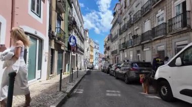 European vacation walk Lisbon city old street cobblestone alleyway point of view
