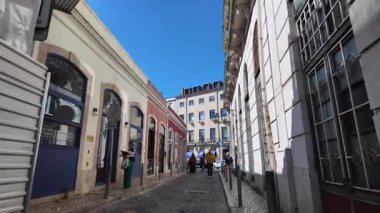 Exploring narrow Lisbon alley Portugal old town street
