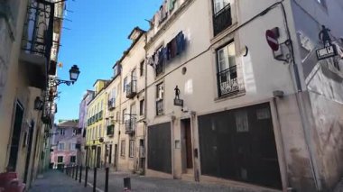 First person walk Lisbon cobbled lane Portugal old district