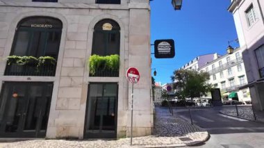 POV walking through traditional Lisbon street Portugal travel idea