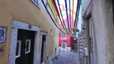 Happy Lisbon streets filled with lights, food and dancing