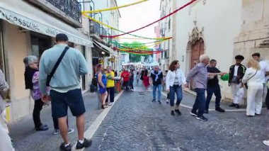 Colorful city street in Lisbon full of Saint Anthony joy