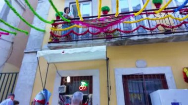 Saint Anthony night in Lisbon with bright lights and dancing feet