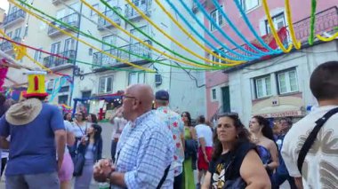 Street filled with Lisbon people celebrating Saint Anthony joyfully