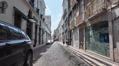 Traditional Lisbon scene with cobblestone street locals and travel mood