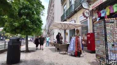 Cultural city walk in Lisbon on summer day with historic buildings