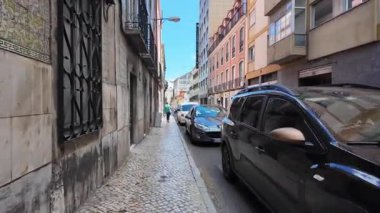 pov tourist walk Lisbon Portugal summer old town cobblestone historic district