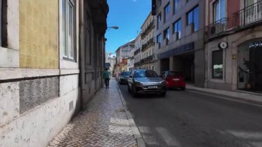 sunny Lisbon pov through historic Portugal streets summer day urban tourism