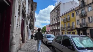 sunny Lisbon pov street walk tourist exploring Portugal capital colorful facades historic vibe
