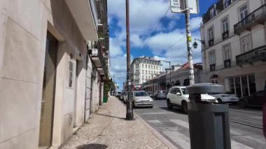 walking tour pov of Lisbon Portugal old town in summer warm city view