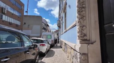 summer travel pov Lisbon Portugal walking through colorful streets in old town