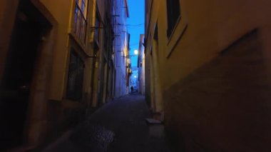 Evening walk in Lisbon city center with old streets, summer lights, and romantic Europe travel mood