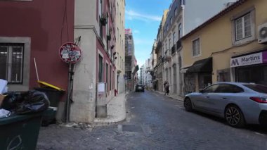 Walking POV Lisbon old town, summer light, historic architecture, sunny Europe travel