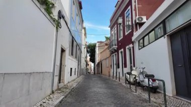 Summer Lisbon POV walk, cobblestone streets, historic charm, sunny European city travel