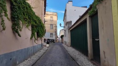 Summer POV walk in Lisbon streets with historic architecture, sunny city travel vibes in Europe