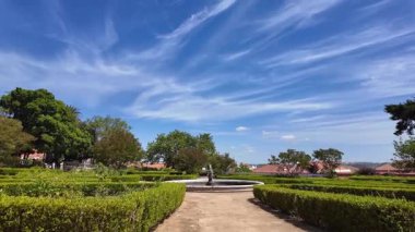 Lisbon city POV walking park summer sunlight green trees holiday travel architecture destination