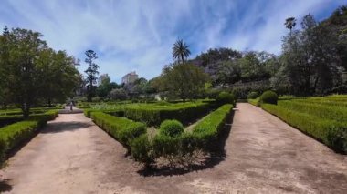 POV Lisbon summer park stroll sunshine green landscape Europe city architecture vacation concept