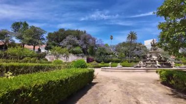 Sunny day Lisbon city park POV walking green trees Europe travel concept architecture background