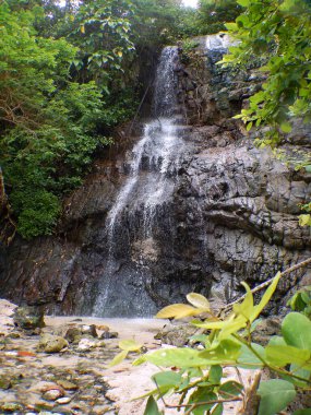 Photo of a small waterfall at Banyuwangi beach, Indonesia clipart