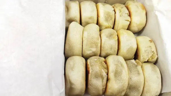 stock image Box of Bakpia, one of Indonesian famous snack from Jogjakarta, is a small, round-shape Indonesian sweet, usually stuffed with mung beans