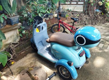 Jakarta, Indonesia - September 28, 2024: Three wheeled Electric bike of Pacific Crosser VX on a parking lot clipart